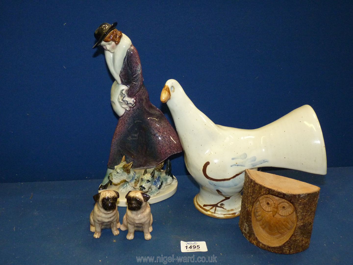 A small quantity of china to include; a porcelain figure of a lady with her dog, white dove,
