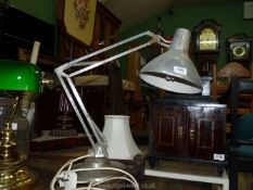A grey '1001 Lamps Ltd' angle poise lamp.