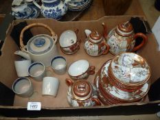 A quantity of china to include; an egg shell Oriental china tea set with teapot, milk jug,