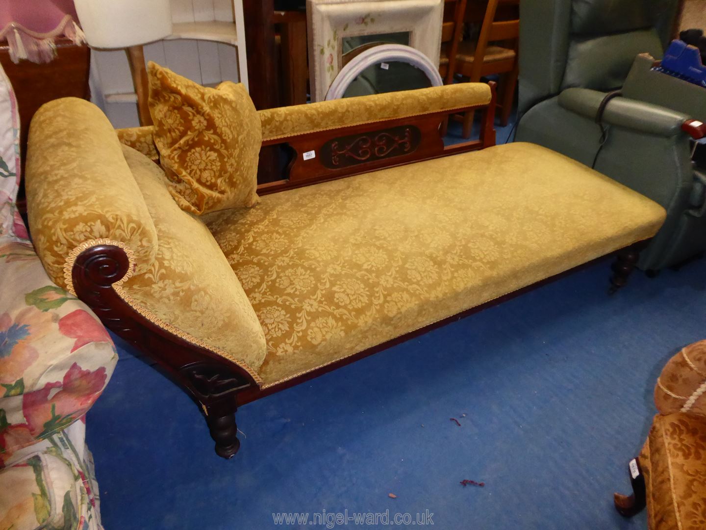 A circa 1900 Chaise Longue standing on turned legs and upholstered in brown/gold coloured shadow