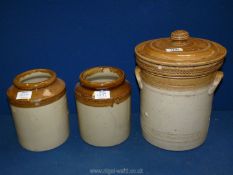 A pair of stoneware storage jars (8" tall),