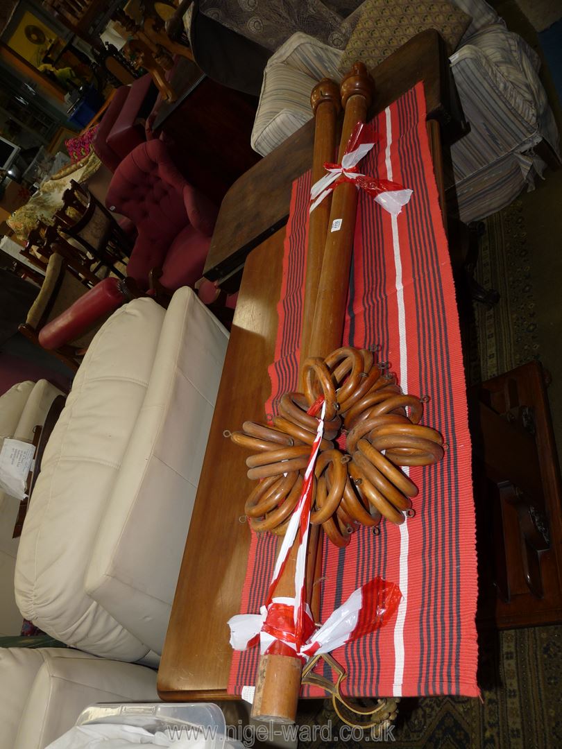 A circa 1900 Mahogany curtain Pole in two threaded end sections and having intricately turned end