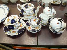 A Gaudy Welsh china Teaset with eight cups, twelve saucers, teapot, jug,