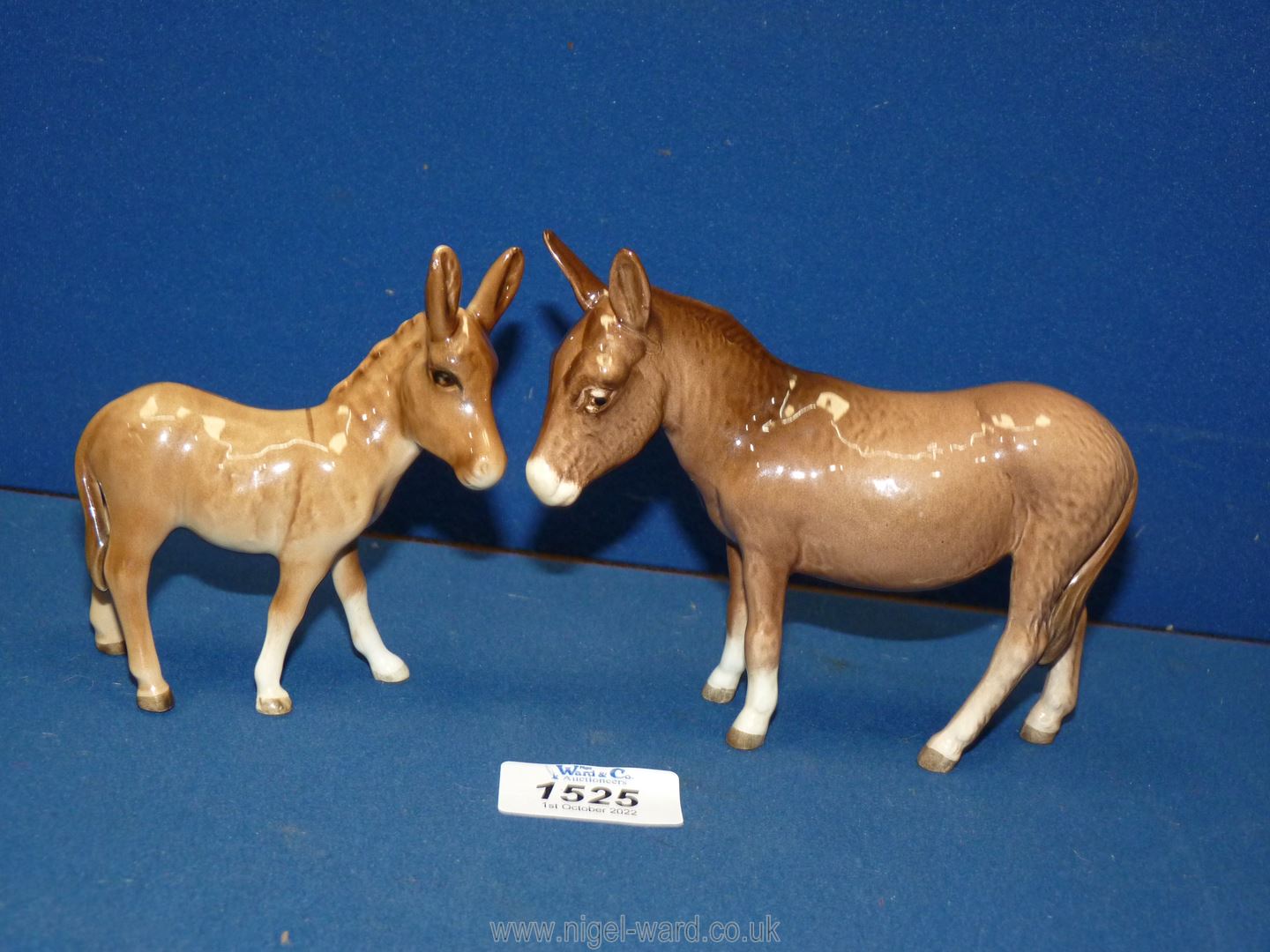 A Beswick donkey and foal, 4" tall and 4¼" tall.