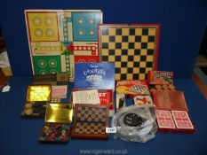 A box of miscellaneous games including wooden draughts, crossword lexican, pocket chess & checkers,