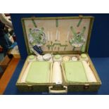 A mid-century Brexton's picnic set with original label, one hinge a/f.