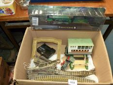 A box of Hornby Dublo three-rail curved and straight track, points,