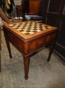 A most appealing Games Table of mixed woods having a chequer/chess board top with burrwood banding,