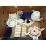 A blue Tetley teapot and toast rack, Lurpak toast rack and a Tupton ware toast rack,