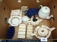 A blue Tetley teapot and toast rack, Lurpak toast rack and a Tupton ware toast rack,