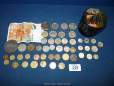 A small quantity of foreign coins and a 2002 five pound coin celebrating the Queen's golden jubilee.