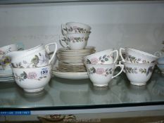 1961 Royal Worcester June Garland set including six cups, saucers, and tea plate, two cake plates,