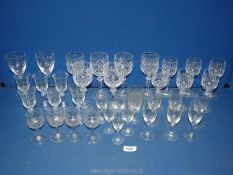 A quantity of glasses including six wine glasses and six matching sherry glasses,