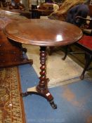 An early 19th century Mahogany & Rosewood circular occasional Table having a turned and twist