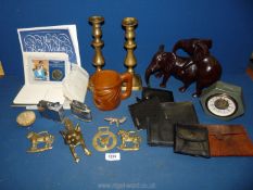 A small quantity of miscellanea including a pair of brass candlesticks, wallets, lighter, brass,