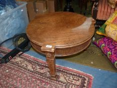 A mixed woods circular occasional Table in Empire style, carved harebell and fluted apron,