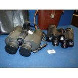A pair of brown leather cased Carl Zeiss binoculars 10 x 50 w and a pair of Pentax 10 x 50