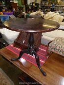 A surprisingly heavy Cuban Mahogany circular occasional Table standing on turned pillar with three