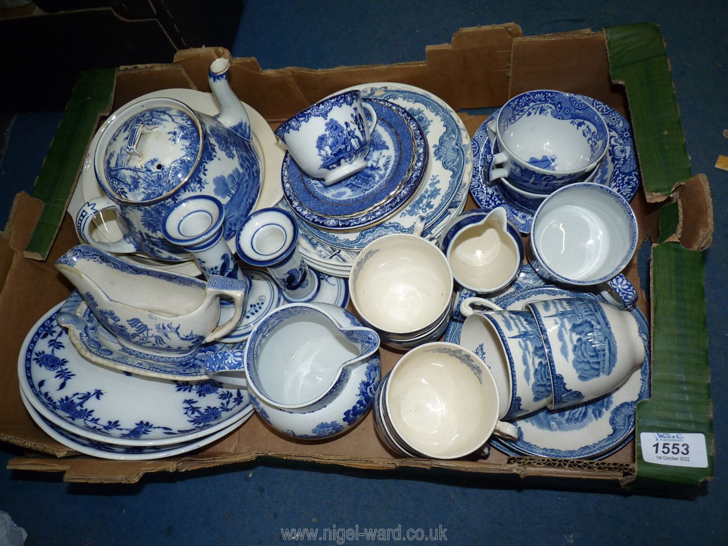 A quantity of blue and white china mostly Old Willow pattern to include Royal Copenhagen plates,