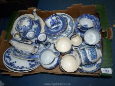 A quantity of blue and white china mostly Old Willow pattern to include Royal Copenhagen plates,