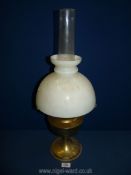 A brass based Aladdin oil Lamp with white shade and chimney, 24" tall.