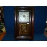 An American 'Ogive' wall clock with bird motif to the glass, the movement striking on a gong,