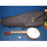 A cased Kmise four string banjo ukulele, in a violin case.