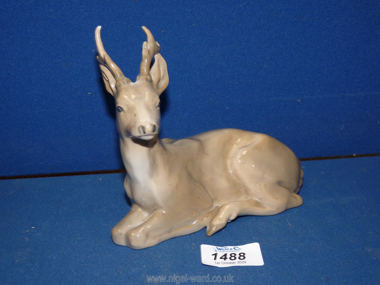 A Royal Copenhagen Stag 'Knud Kyhn 1906', 5 3/4" tall x 6 1/4" long.