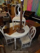 A grey painted finish Dining Suite comprising a circular dining table on turned and fluted legs,