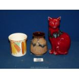 A rare Poole pottery red seated Cat, 7" tall (graze to ear),