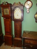 A cross-banded Oak framed 30 hour Longcase Clock having an arched painted face with stylised floral