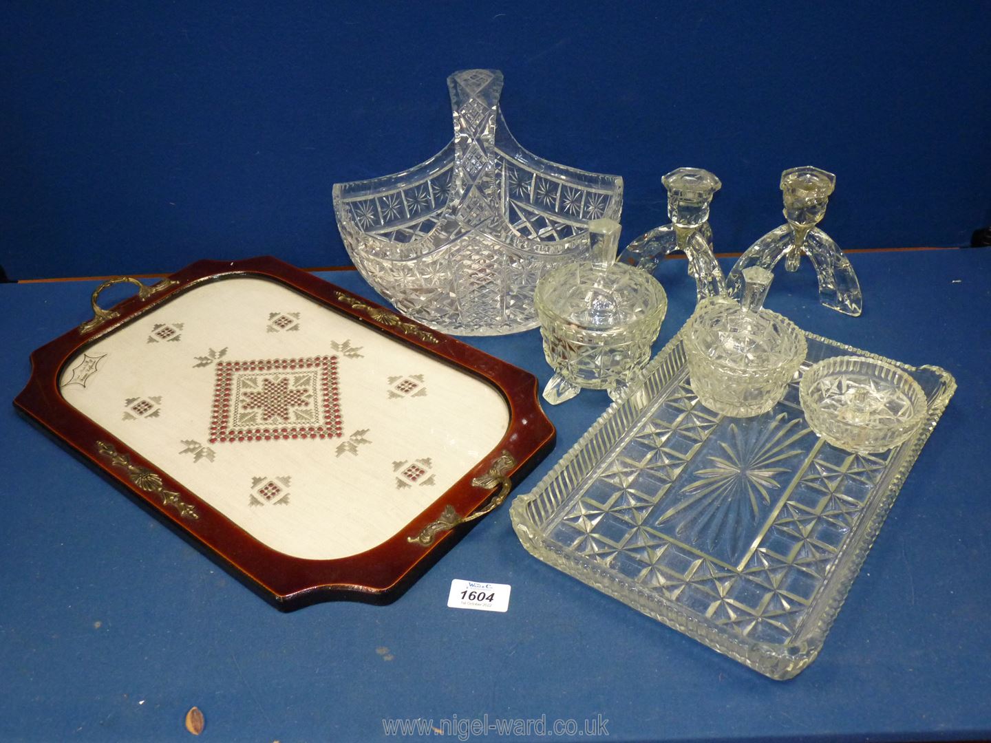 A dressing table tray with embroidered lace under glass,