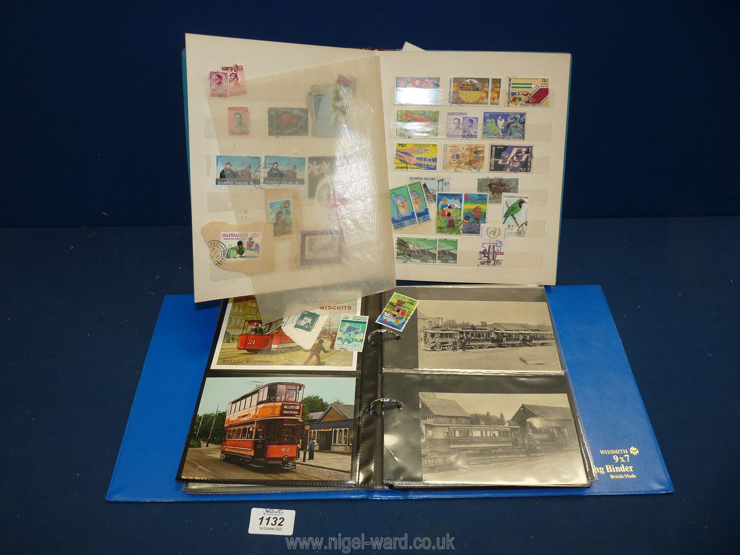 A Stamp album containing foreign stamps, plus a Postcard album.