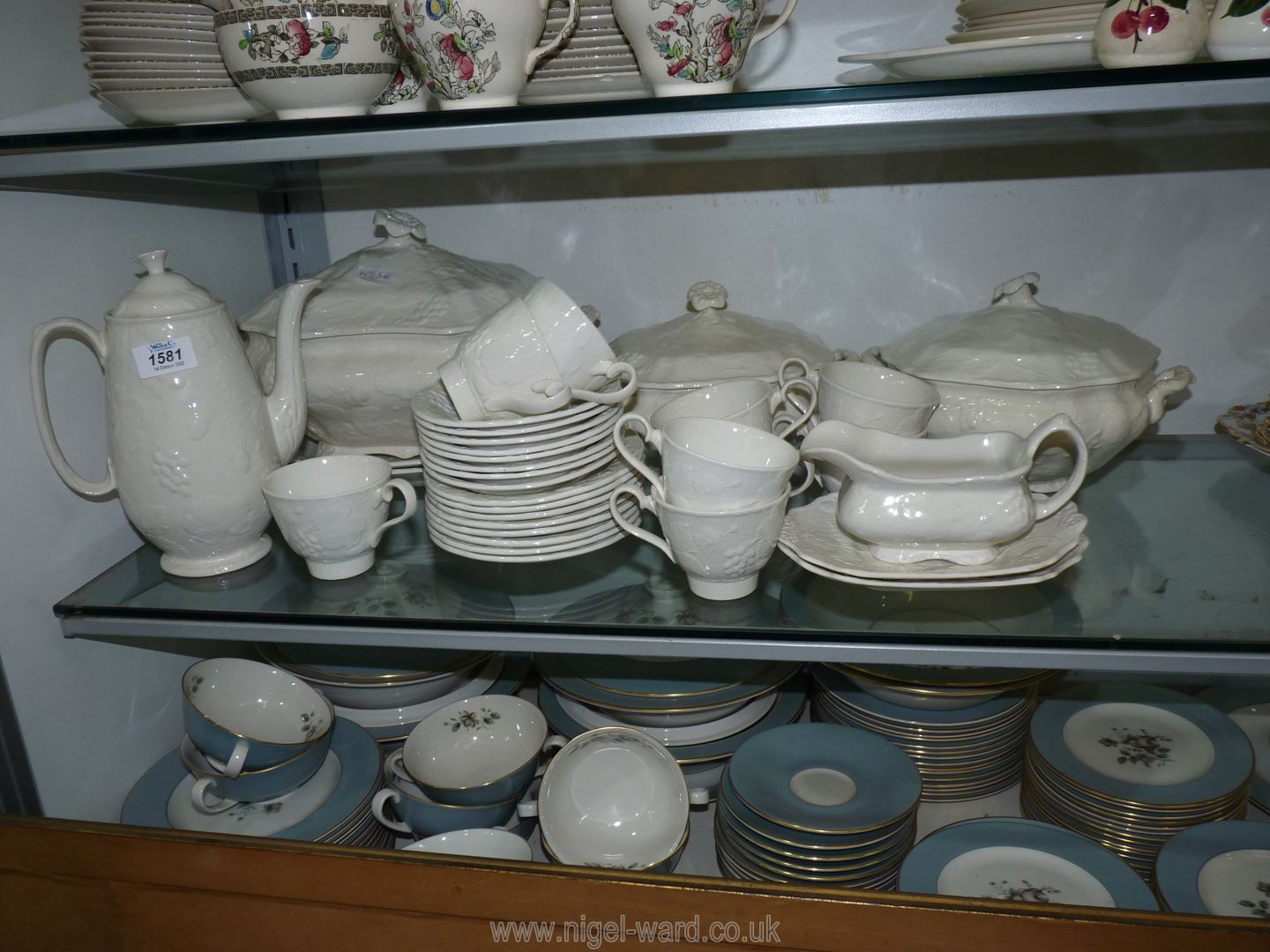 A quantity of Burleigh Staffordshire tea and dinner ware in cream with embossed fruits and vines
