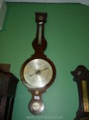 A four point Walnut Banjo barometer by ''Boorman, Gravesend'' having barometer, hygrometer,