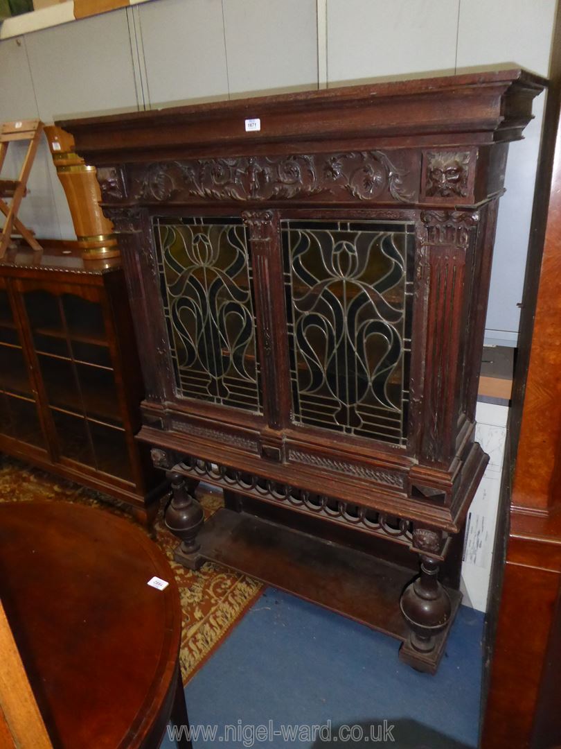 A most unusual Oak Cabinet on stand having a pair of opposing intricately coloured leaded glazed - Image 2 of 5