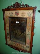 A most appealing rectangular wall mirror having an elaborate Walnut frame with a shell pediment and