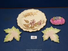 A Royal Worcester Plate with scalloped and raised edges, having purple, orange floral decoration,