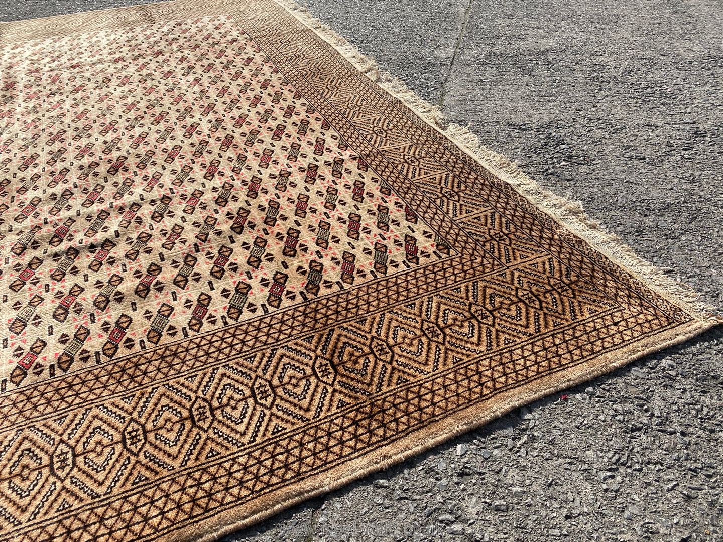 A vintage Tekke Turkoman Carpet with overall petit flower head design on beige field, - Image 4 of 4