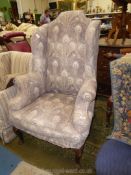 An elegant wing fireside Armchair of Georgian shape,