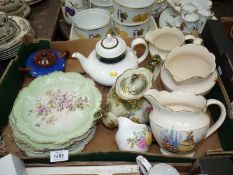 Two teapots; one being Royal Doulton, plus several antique plates, three Falconware graduated jugs,