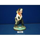 A rare vintage 1930's Ditmar Urbach ceramic figure of a boy carrying a book from Czechoslovakia,