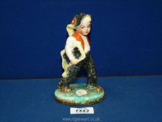 A rare vintage 1930's Ditmar Urbach ceramic figure of a boy carrying a book from Czechoslovakia,