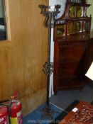 A wrought iron Torchere, 60'' high.