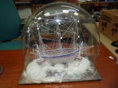 A most unusual well modelled/sculpted glass three masted Sailing Vessel in stormy seas with two