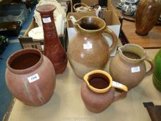 One large glazed stoneware jug (13" tall), two smaller stoneware jugs (9 1/2" and 8" tall),