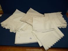 Five Victorian lace tablecloths and two lace pillowcases.