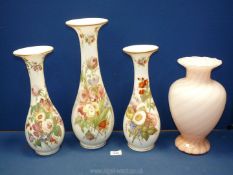 A garniture of three Victorian opaque glass Vases with hand painted flowers,