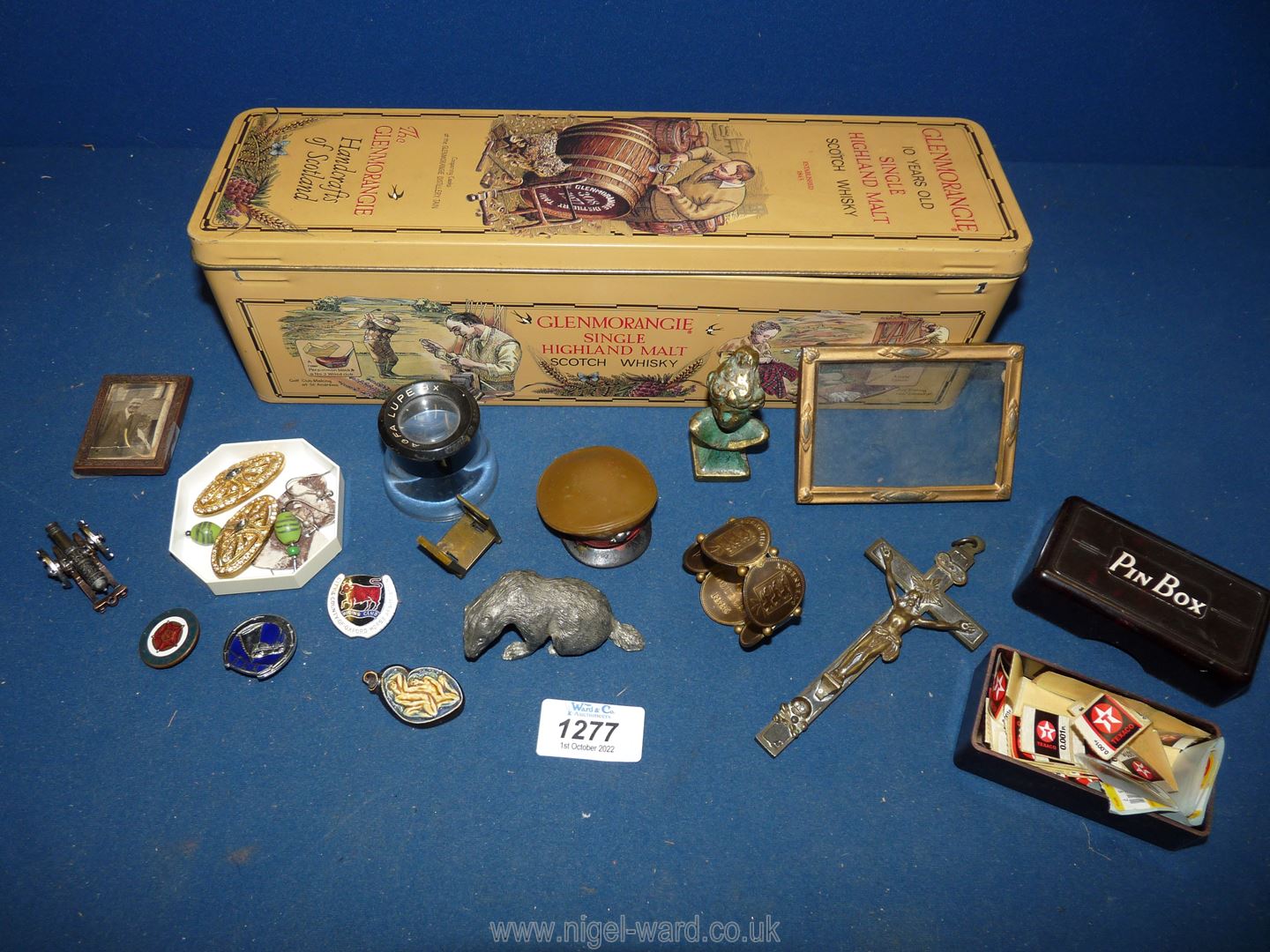 A quantity of miscellanea including antique thread counter, small crucifix, badges, etc.