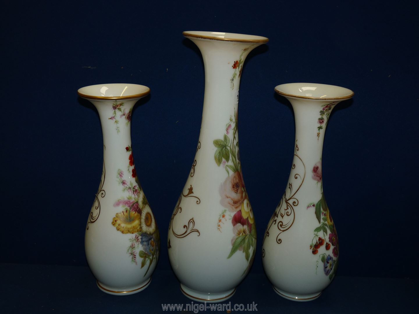 A garniture of three Victorian opaque glass Vases with hand painted flowers, - Image 5 of 17